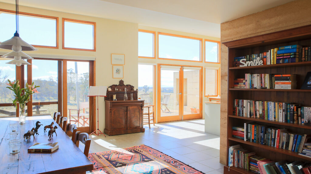 Timber picture window highlights above French doors